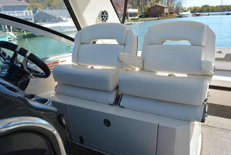 Slide: The Image of Luxury seating on 2013 Monterey 340 Sport Yacht, featuring plush white upholstery. - 24