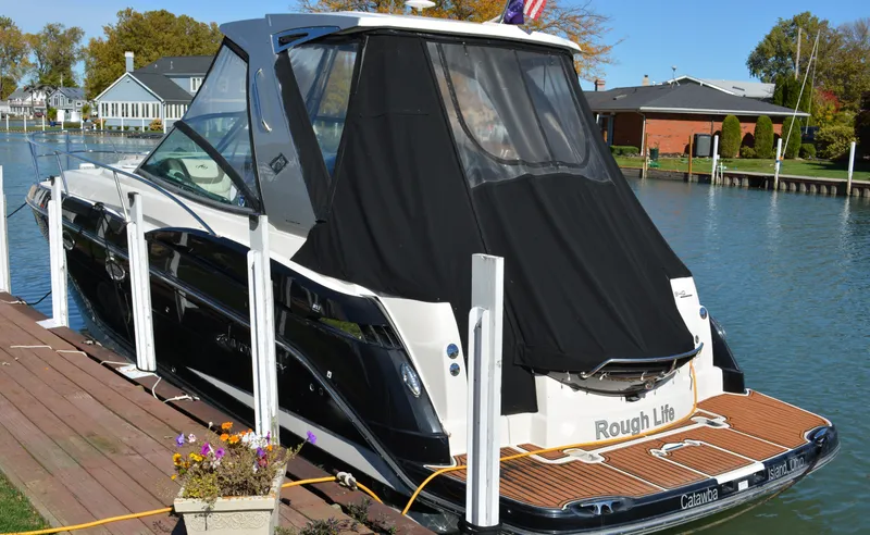 Slide: The Image of 2013 Monterey 340 Sport Yacht docked by waterfront homes. - 3