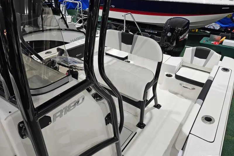 Slide: The Image of 2025 Robalo R180 Center Console boat interior with seating and console details. - 13