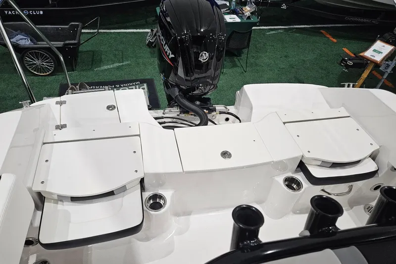 Slide: The Image of 2025 Robalo R180 Center Console boat with Mercury outboard engine, rear deck view. - 19