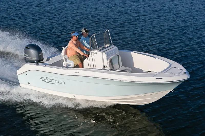 Slide: The Image of Manufacturer Provided Image: 2025 Robalo R180 Center Console boat cruising on open water. - 23