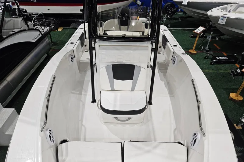 Slide: The Image of 2025 Robalo R180 Center Console boat interior at a showroom display. - 7