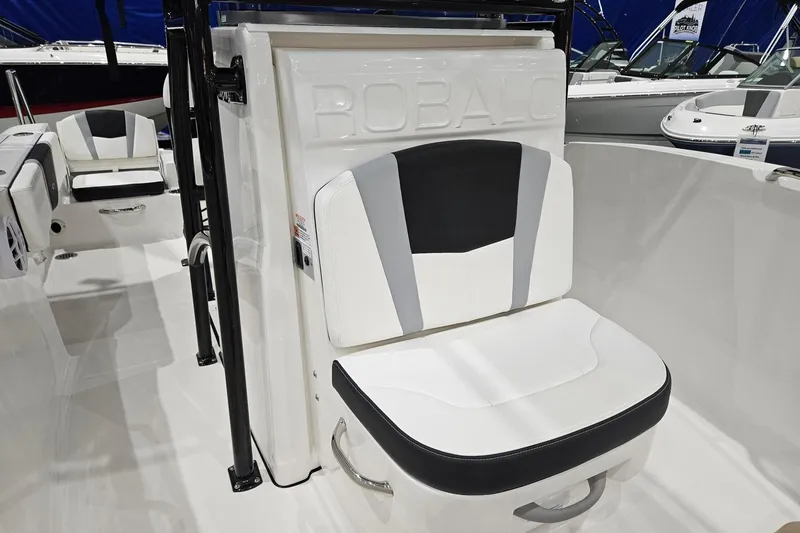 Slide: The Image of 2025 Robalo R180 Center Console boat interior with stylish seating and modern design. - 8