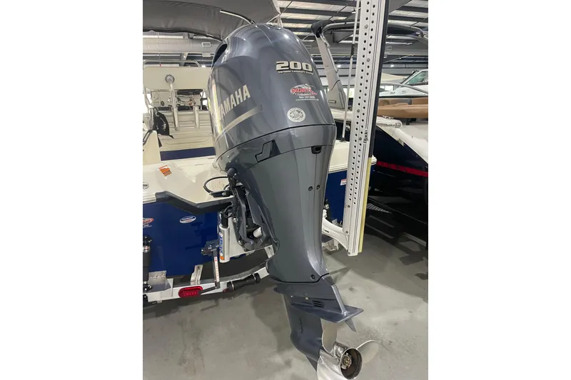 Slide: The Image of 2015 Skeeter SX2250 boat with Yamaha 200 outboard motor in a showroom. - 10