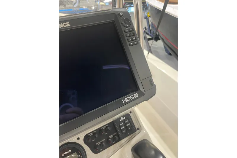 Slide: The Image of Close-up of a 2015 Skeeter SX2250 boat dashboard with HDS-12 display. - 14