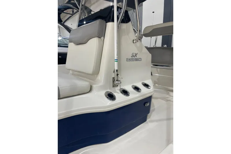 Slide: The Image of 2015 Skeeter SX2250 boat interior with seating and rod holders. - 8