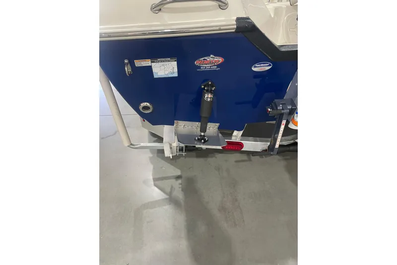 Slide: The Image of 2015 Skeeter SX2250 boat transom with hydraulic components and labels. - 9