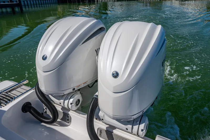 Slide: The Image of Twin Yamaha outboard engines on 2023 Sportsman Open 302 Center Console boat. - 20