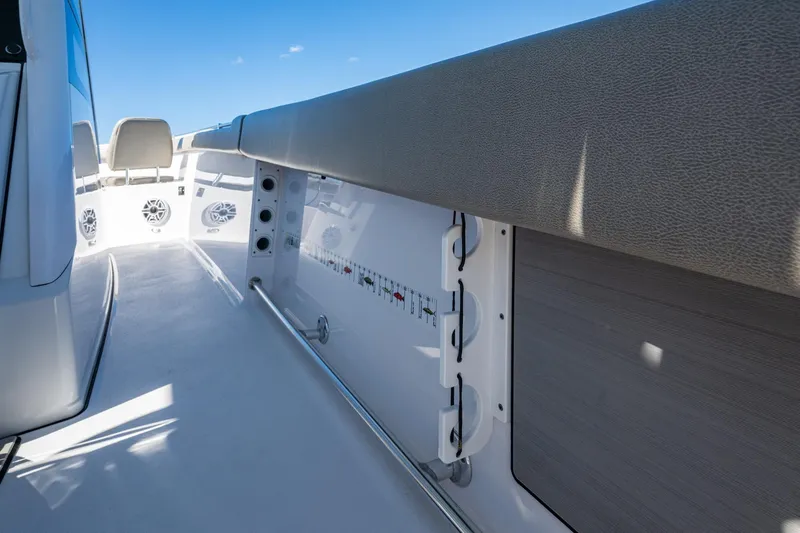 Slide: The Image of 2023 Sportsman Open 302 Center Console interior with seating and storage features. - 29