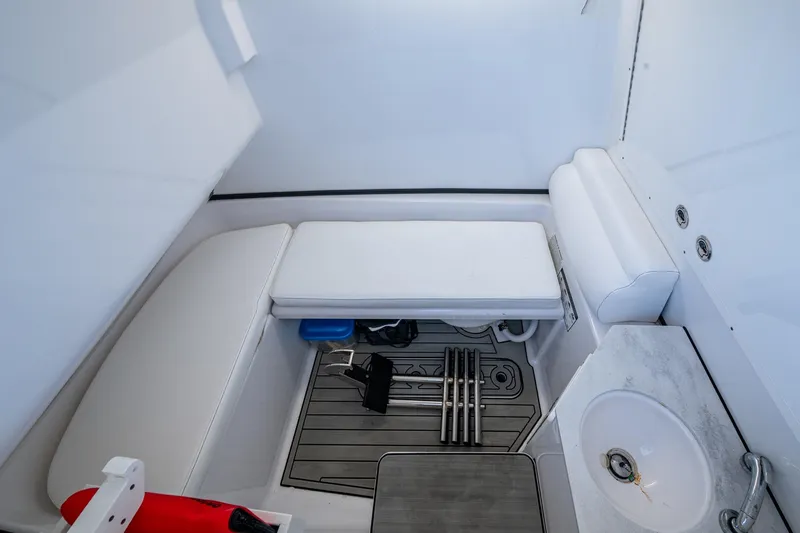 Slide: The Image of 2023 Sportsman Open 302 Center Console interior with seating and sink. - 37