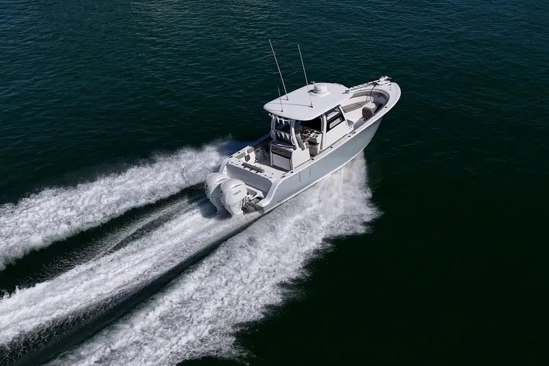 Slide: The Image of 2023 Sportsman Open 302 Center Console cruising on open water. - 67