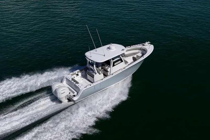 Slide: The Image of 2023 Sportsman Open 302 Center Console boat cruising on open water. - 68