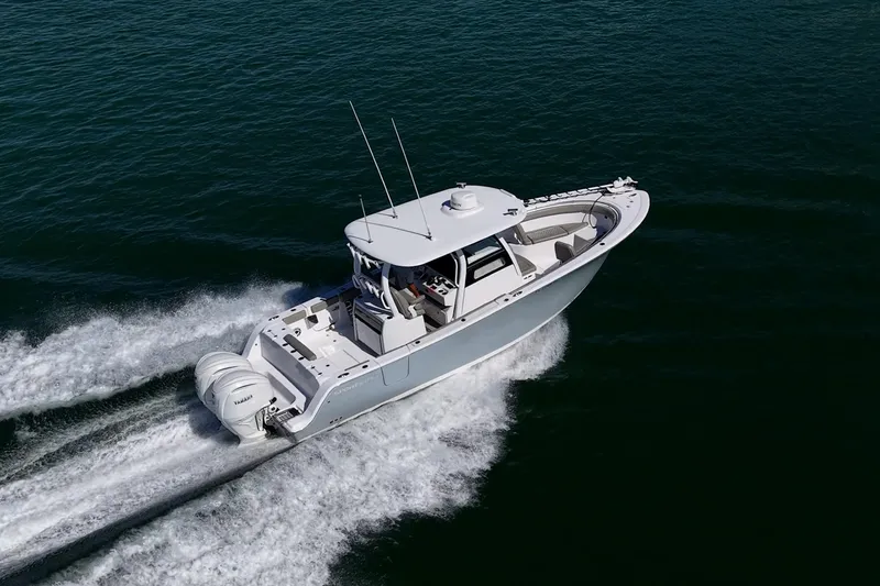 Slide: The Image of 2023 Sportsman Open 302 Center Console boat cruising on open water. - 69