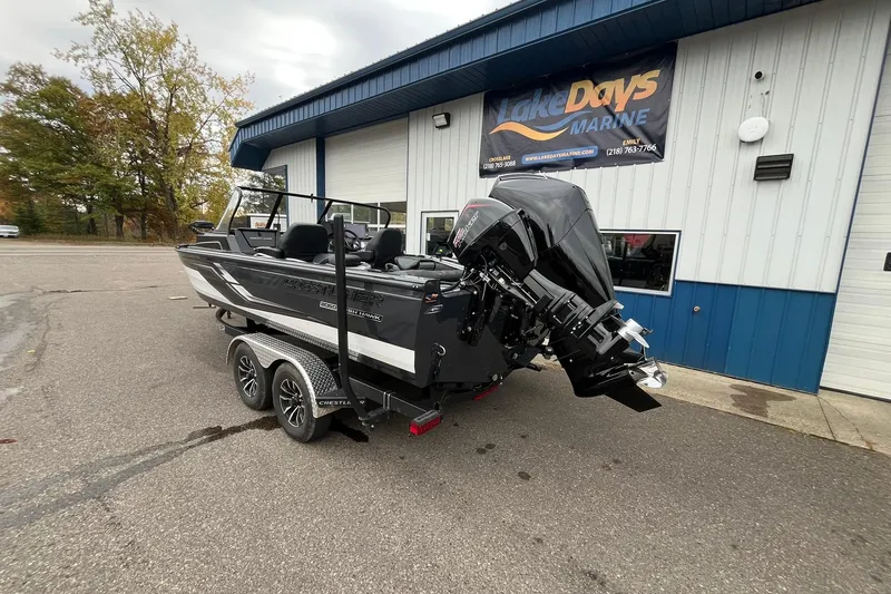 Slide: The Image of 2025 Crestliner 2050 Fish Hawk boat on trailer outside Lake Days Marine. - 1