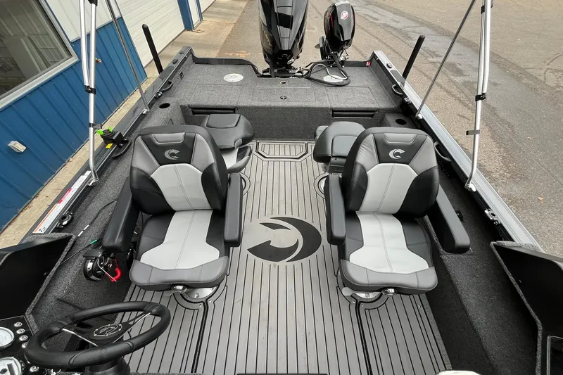 Slide: The Image of 2025 Crestliner 2050 Fish Hawk interior with dual seats and modern design. - 15