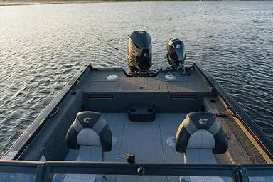 Slide: The Image of Manufacturer Provided Image: 2026 Crestliner 2050 Fish Hawk boat on water, featuring dual motors and seating. - 21