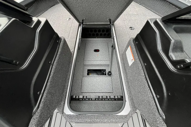 Slide: The Image of 2025 Crestliner 2050 Fish Hawk boat storage compartment, open and empty. - 23