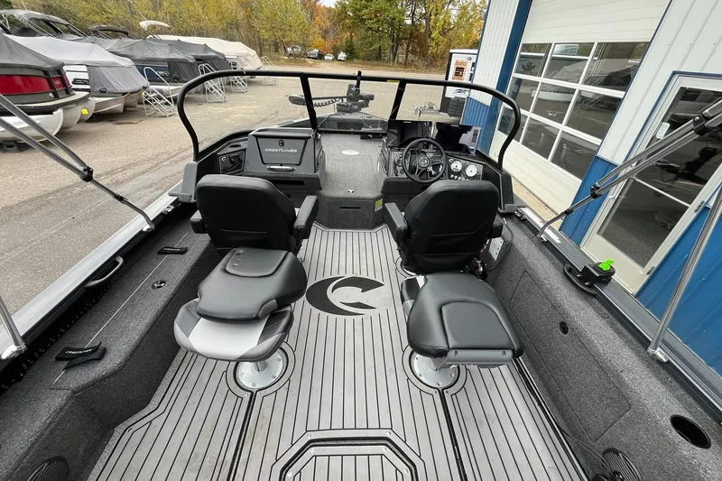 Slide: The Image of 2025 Crestliner 2050 Fish Hawk boat interior with seating and control panel. - 6