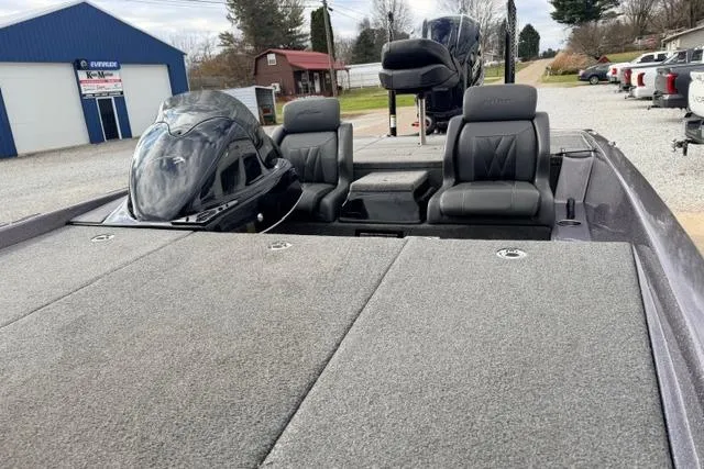 Slide: The Image of 2024 Falcon Boats F195 with dual seats and spacious deck, parked outdoors. - 10