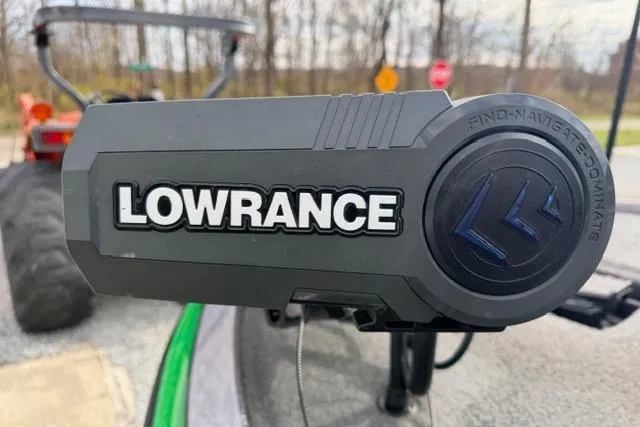 Slide: The Image of Lowrance device on 2024 Falcon Boats F195, outdoor setting with blurred background. - 11