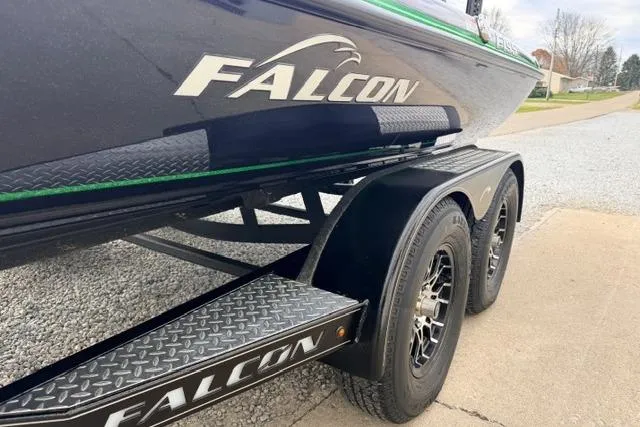 Slide: The Image of 2024 Falcon Boats F195 on trailer, showcasing sleek design and branding. - 13