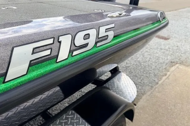 Slide: The Image of 2024 Falcon Boats F195, close-up of sleek design with green accent stripe. - 14