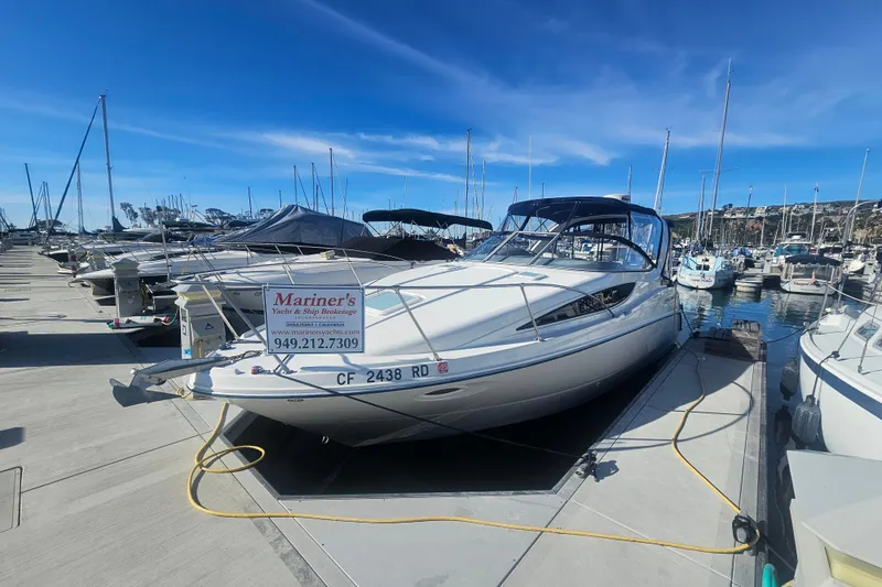 The Image of 2005 Bayliner 2855 Ciera docked at marina under clear blue sky. - 0