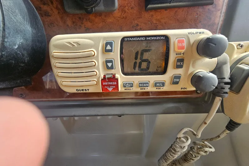 Slide: The Image of VHF radio on 2005 Bayliner 2855 Ciera boat dashboard, displaying channel 16. - 20