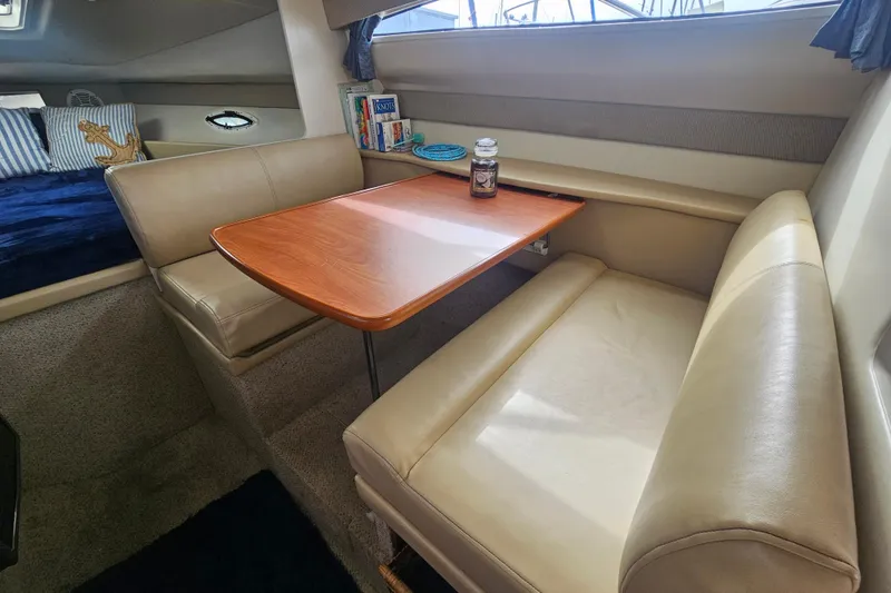 Slide: The Image of Interior of 2005 Bayliner 2855 Ciera with dining area and cozy seating. - 23