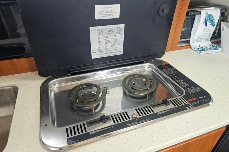 Slide: The Image of Electric stove in 2005 Bayliner 2855 Ciera boat kitchen, featuring dual burners. - 31