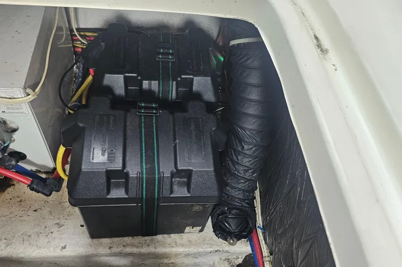 Slide: The Image of Battery compartment of 2005 Bayliner 2855 Ciera boat, featuring dual battery setup. - 36
