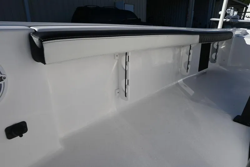 Slide: The Image of 2026 Tidewater 2300 Carolina Bay boat interior with cushioned seating and sleek design. - 12