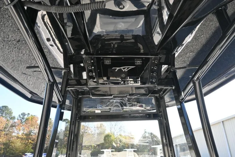 Slide: The Image of 2026 Tidewater 2300 Carolina Bay boat interior with sleek black finish and modern design. - 14