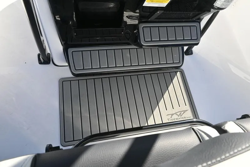 Slide: The Image of 2026 Tidewater 2300 Carolina Bay boat deck with branded non-slip flooring. - 17