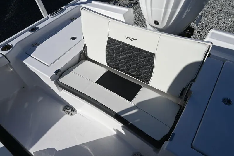 Slide: The Image of 2026 Tidewater 2300 Carolina Bay boat seat with black and white upholstery design. - 18