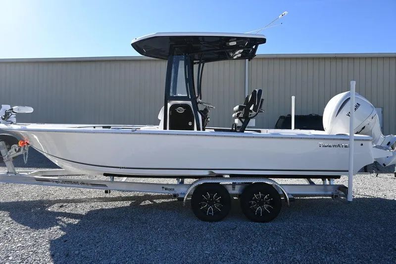 Slide: The Image of 2026 Tidewater 2300 Carolina Bay boat on trailer, side view, outdoors. - 4