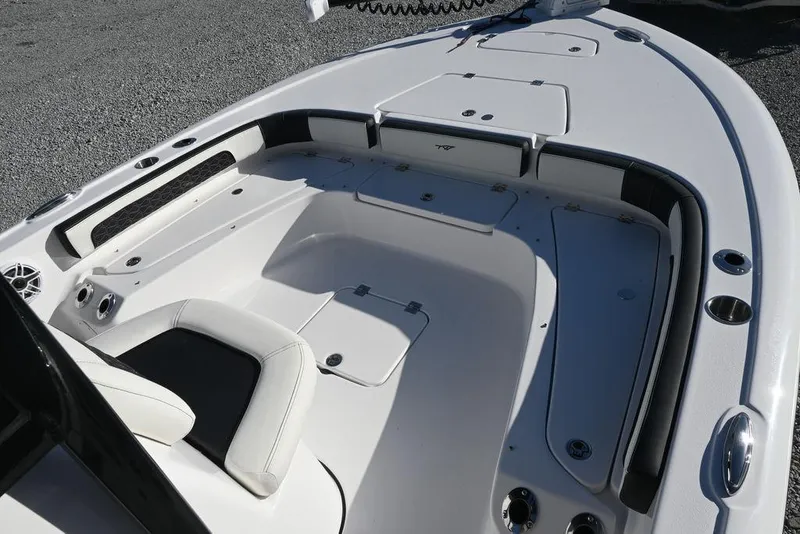 Slide: The Image of 2026 Tidewater 2300 Carolina Bay boat interior with seating and storage compartments. - 5