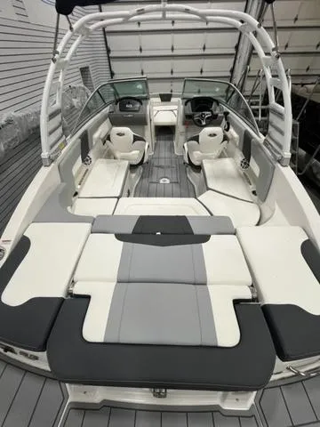 Slide: The Image of 2025 Chaparral 23 SSi boat interior with modern seating and sleek design. - 3