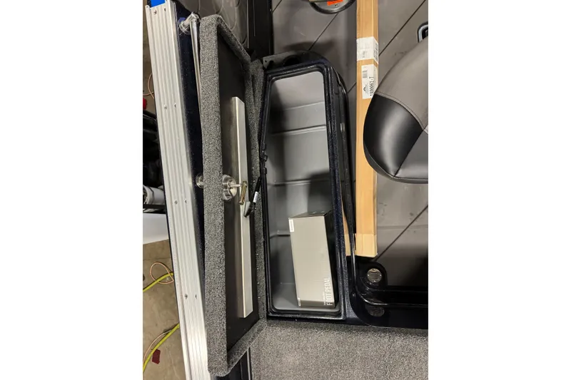 Slide: The Image of Open storage compartment in Nitro ZV20 Pro 2026 boat, showing interior details. - 22