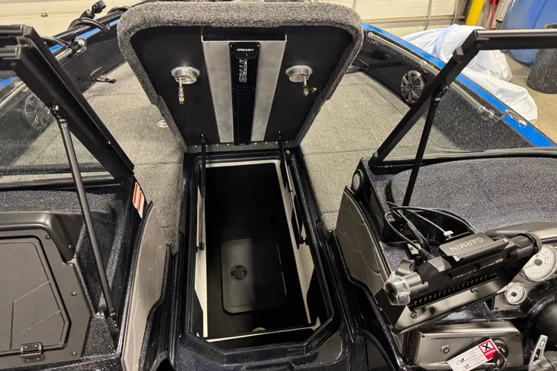 Slide: The Image of Open storage compartment in 2026 Nitro ZV20 Pro boat, featuring Garmin equipment. - 27