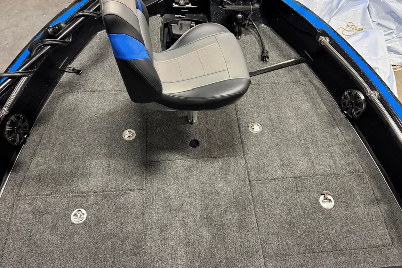 Slide: The Image of Interior of 2026 Nitro ZV20 Pro boat with gray carpet and swivel seat. - 28