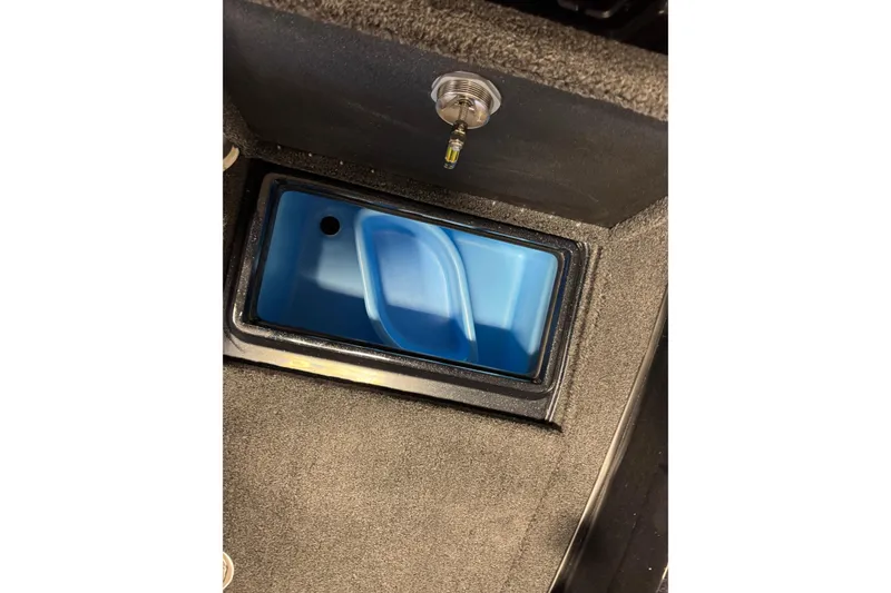 Slide: The Image of Storage compartment in 2026 Nitro ZV20 Pro boat, featuring a blue interior. - 31