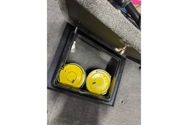 Slide: The Image of Storage compartment in 2026 Nitro ZV20 Pro boat with yellow lids. - 32