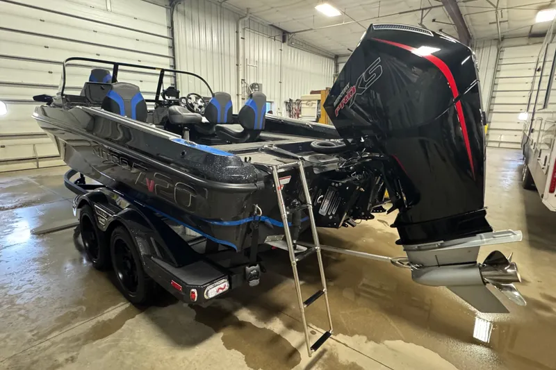 Slide: The Image of 2026 Nitro ZV20 Pro boat with powerful engine in indoor storage. - 4