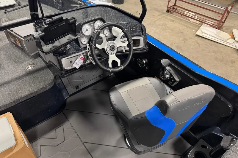 Slide: The Image of Interior of 2026 Nitro ZV20 Pro boat with steering wheel and control panel. - 8