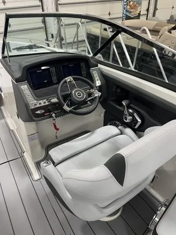 Slide: The Image of 2025 Chaparral 30 Surf boat interior with modern helm and seating. - 3
