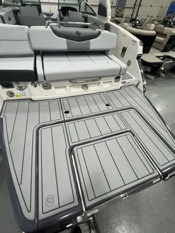 Slide: The Image of 2025 Chaparral 30 Surf boat with spacious rear deck and seating. - 4