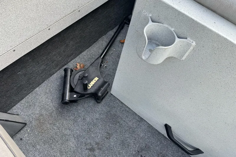 Slide: The Image of 1994 Jetcraft Yukon boat interior with Cannon downrigger and cup holder. - 12