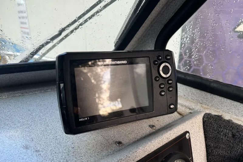 Slide: The Image of Humminbird Helix 5 fish finder inside a 1994 Jetcraft Yukon boat. - 17