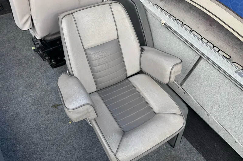 Slide: The Image of Gray leather seat in a 1994 Jetcraft Yukon boat interior. - 18